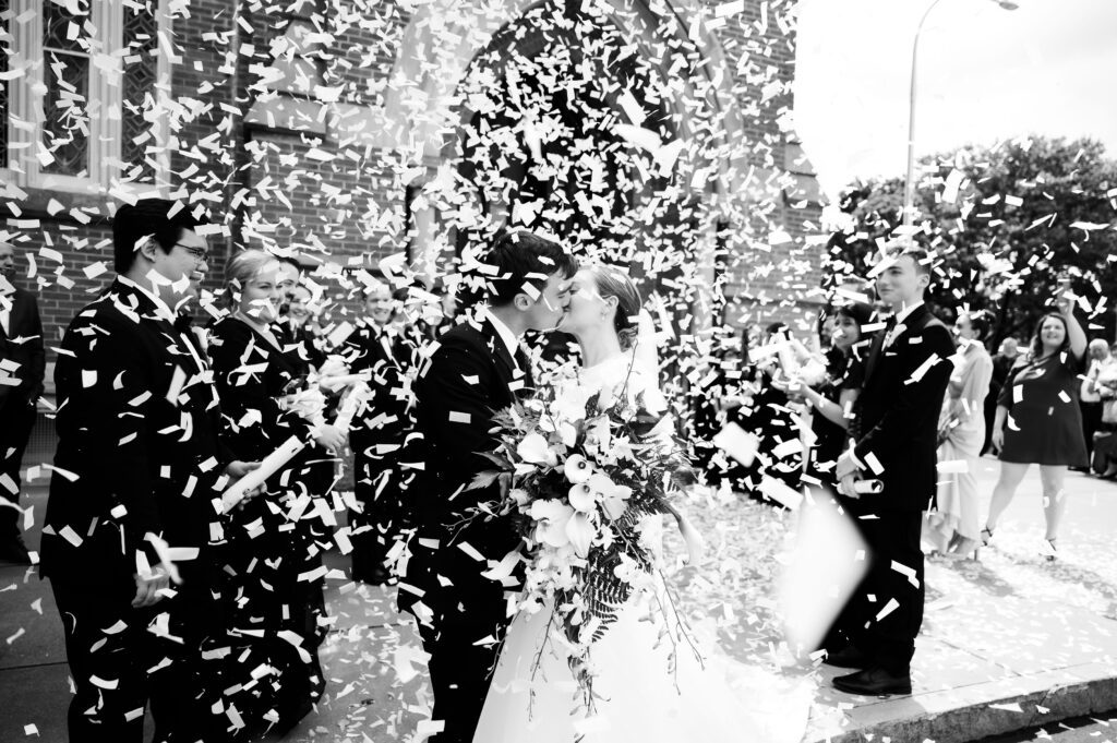 Biodegradable confetti wedding exit outside Park Central presbyterian church in downtown Syracuse, New York