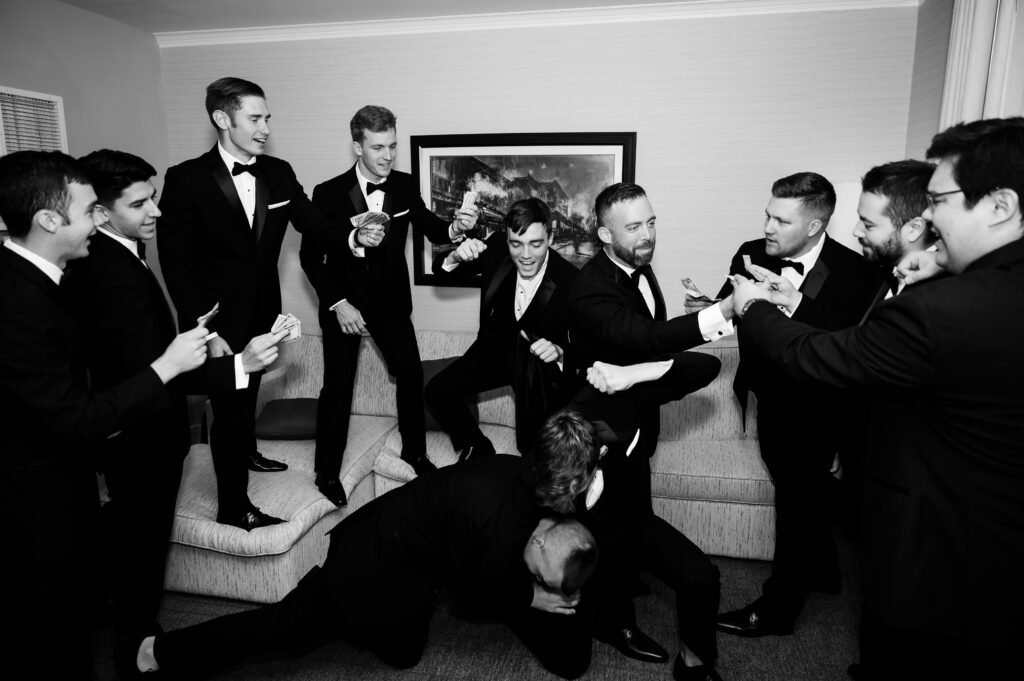 Groomsmen and Groom getting ready shots before wedding day at Marriott Syracuse Downtown.