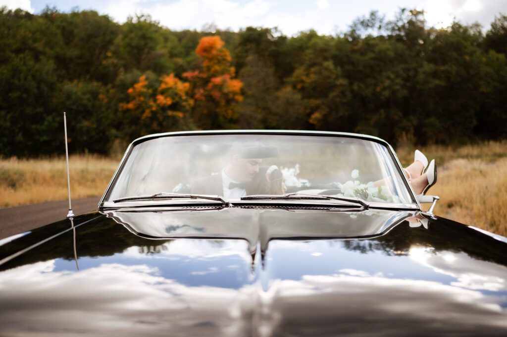 This vintage cruiser parked in the fall foliage of Dallas, Texas tied together a timeless look for these classic car bridals.