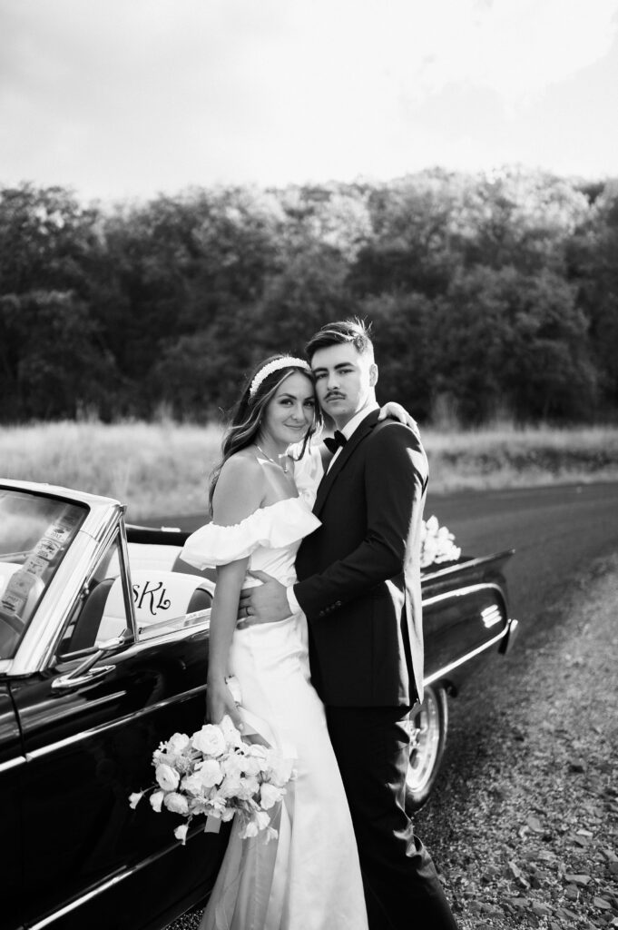 Classic vintage car bridals photoshoot by Dallas TX wedding photographer, white bouquet, black and white photos