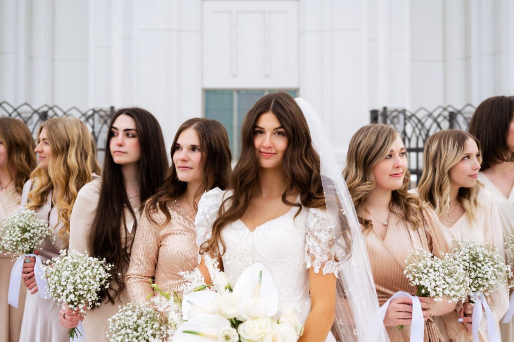 blush bridesmaids dresses and white babys breath bouquets at classic fashion utah winter temple wedding