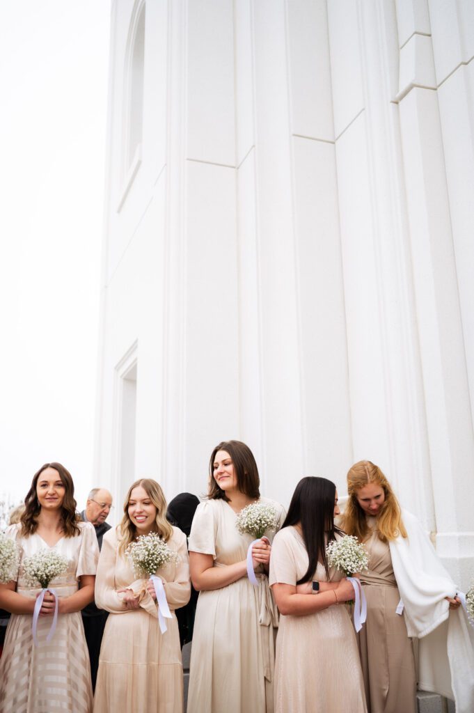 classic fashion blush bridesmaids dresses for utah winter wedding at brigham city temple