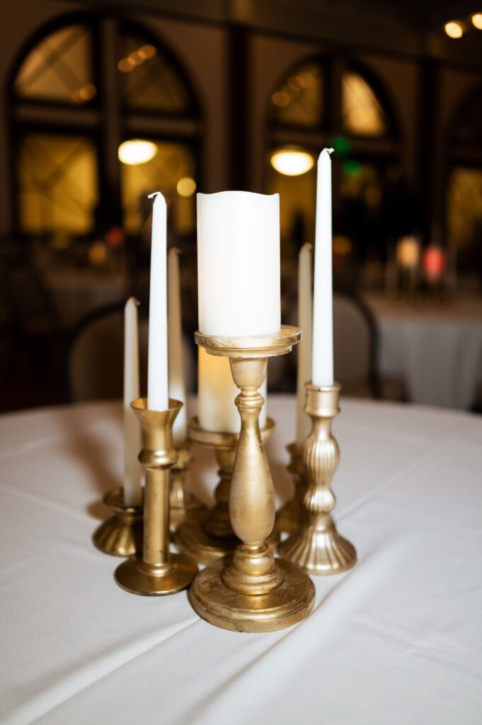 classic fashion winter wedding decor gold candle holders and taper pillar candles