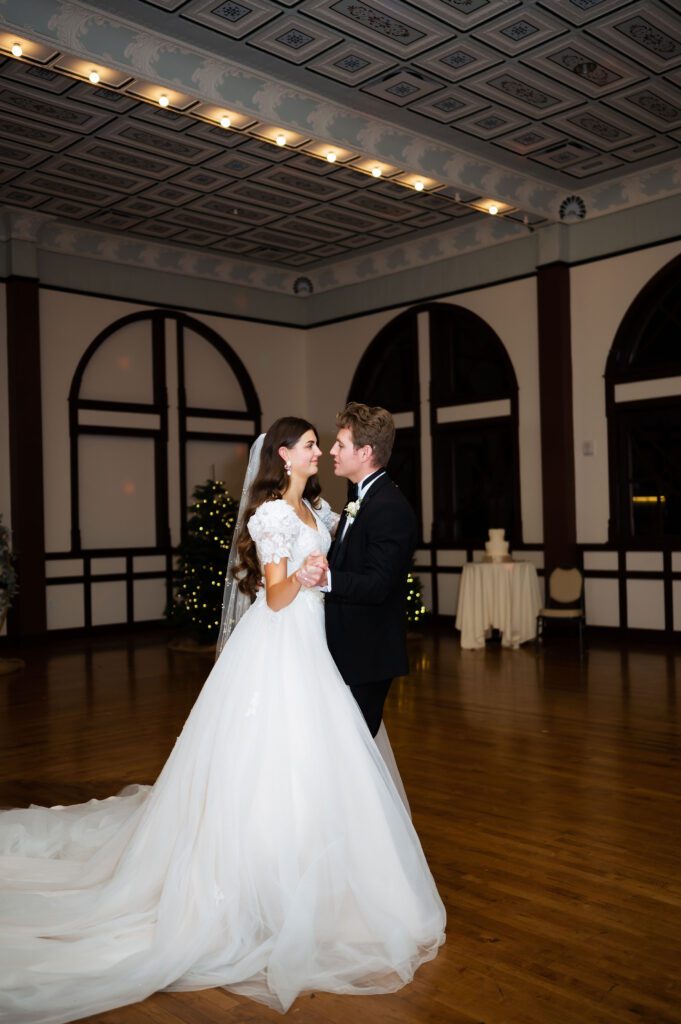 classic fashion newlyweds dance during private last dance at winter wedding in brigham city utah