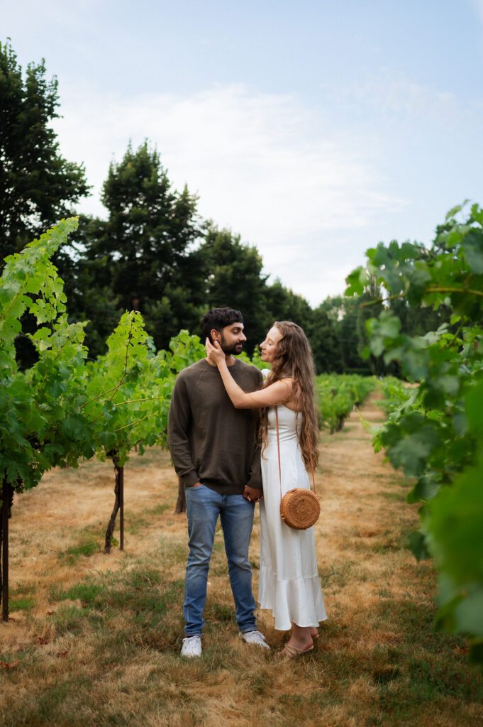 couple taking engagement photos in chateau st michelle winery in seattle washington