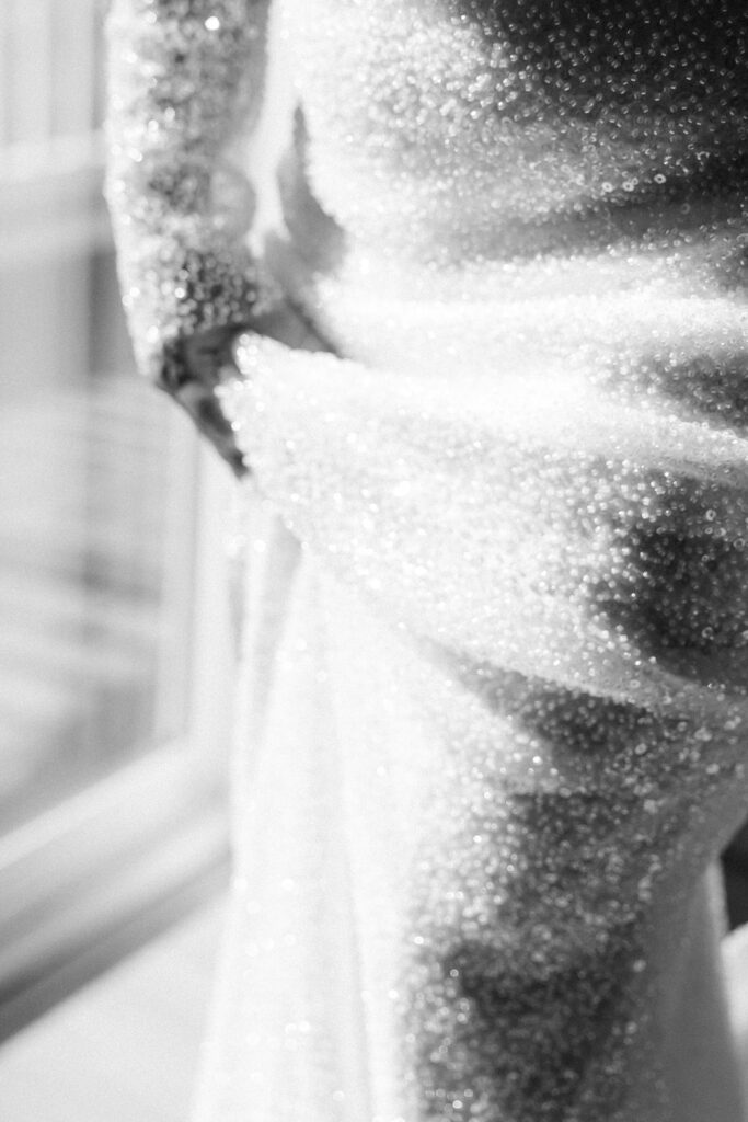 getting ready shots b&w bridal portraits designer glass beaded dress
