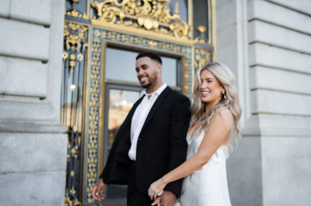 candid documentary style destination wedding photographer poses san francisco city hall elopement couple
