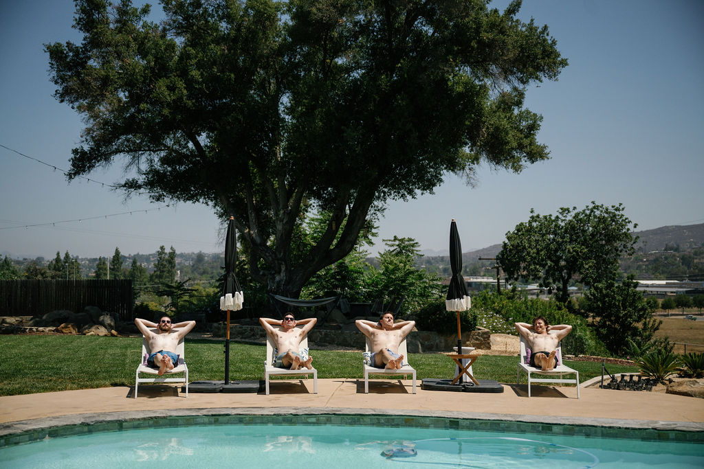 groomsmen getting ready photos, poolside editorial wedding portraits of groom
