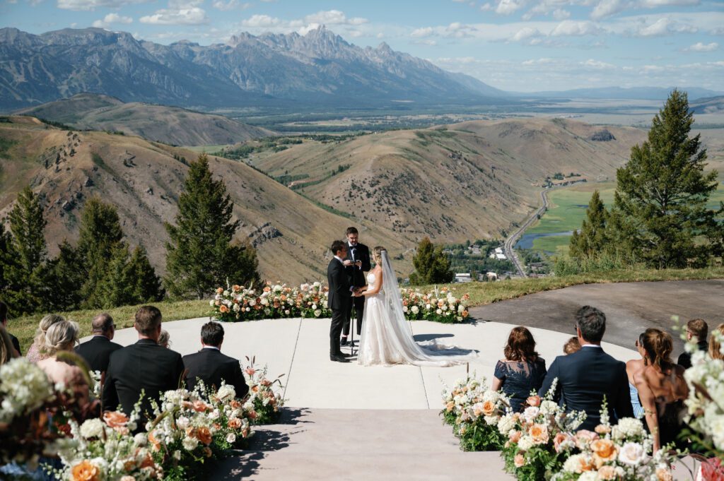 Couple during their outdoor ceremony at Snow King Jackson Wyoming wedding
