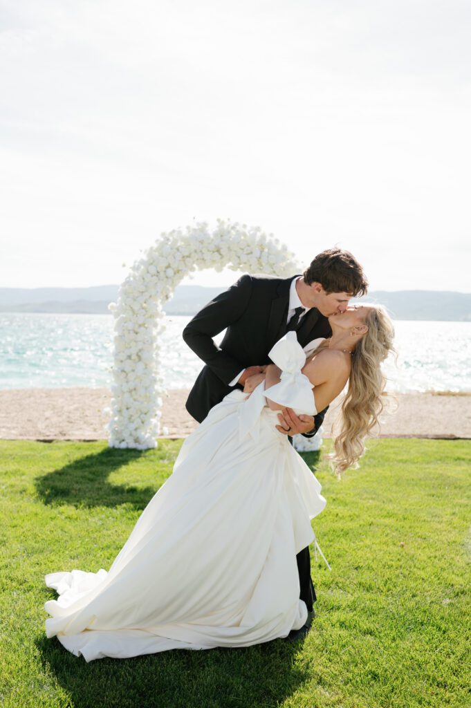 Couple kissing portrait with the beach in the background during Bear Lake Utah wedding