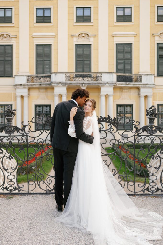 Bride and groom portrait outside of Schoenbrunn Palace Vienna wedding venue