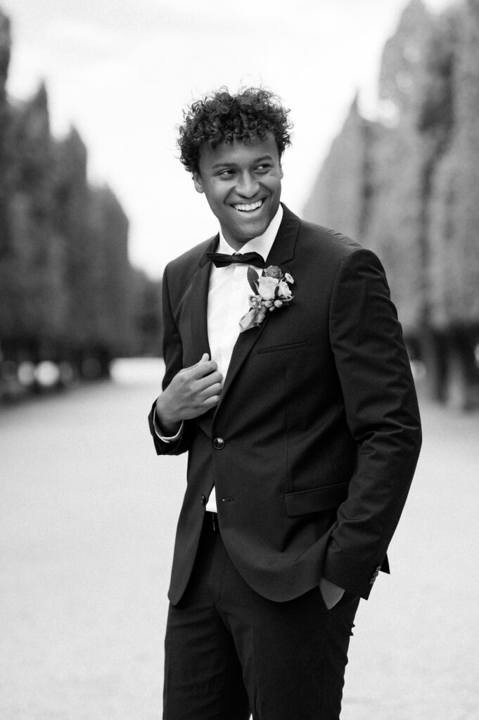 A black and white portrait of the groom at Schoenbrunn Palace Vienna wedding