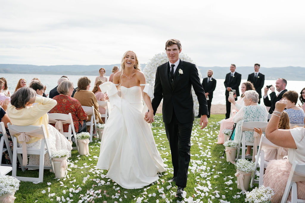 Bride and groom walking down the aisle after first kiss at Bear Lake utah wedding